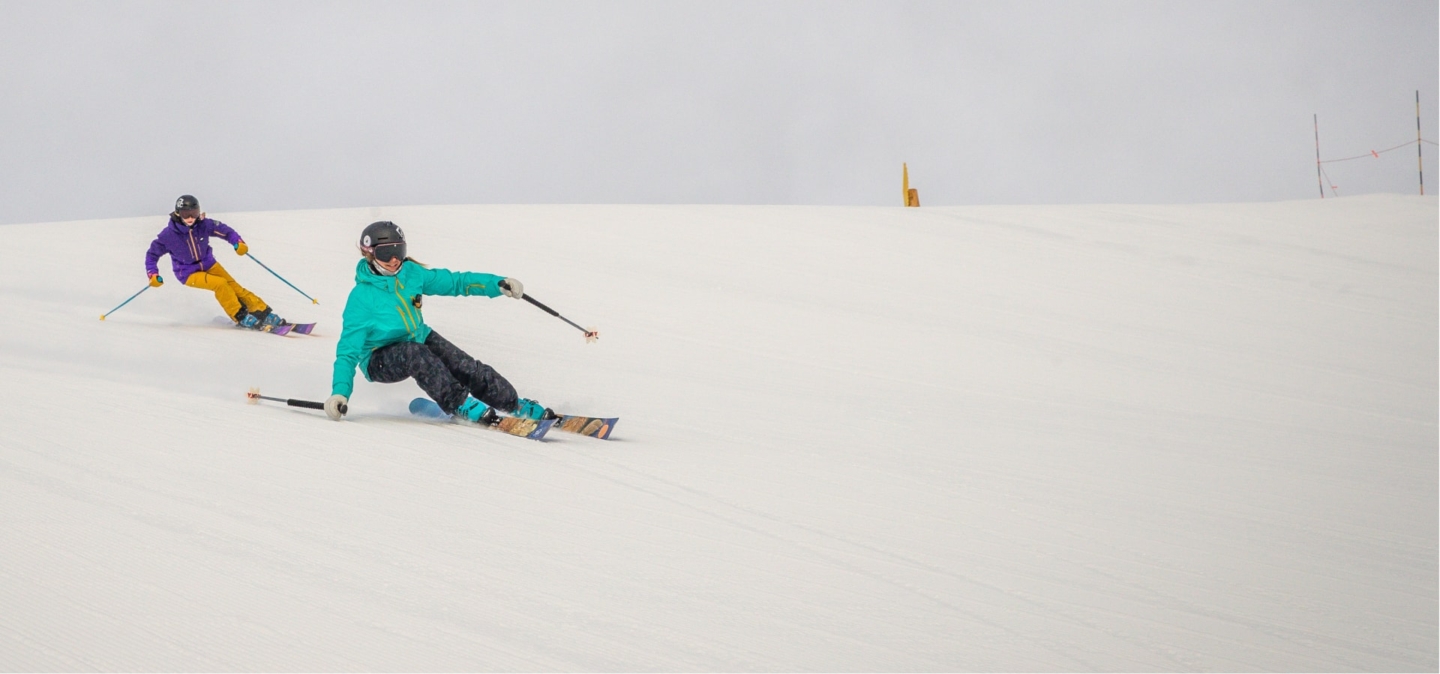 Skiers shredding down mountain in Park City, UT
