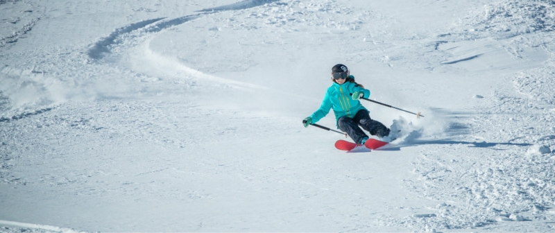 Skier shredding down mountain in Park City, UT
