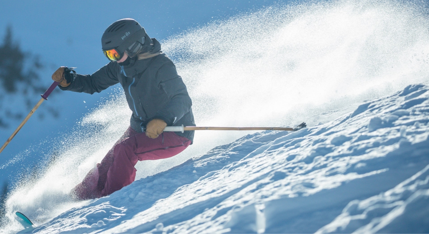 Skier shredding down mountain in Park City, UT
